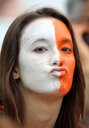 SAO PAULO, BRAZIL - JULY 09: A Netherlands fan enjoys the atmosphere prior to the 2014 FIFA World Cup Brazil Semi Final match between the Netherlands and Argentina at Arena de Sao Paulo on July 9, 2014 in Sao Paulo, Brazil. (Photo by Dean Mouhtaropoulos/Getty Images)