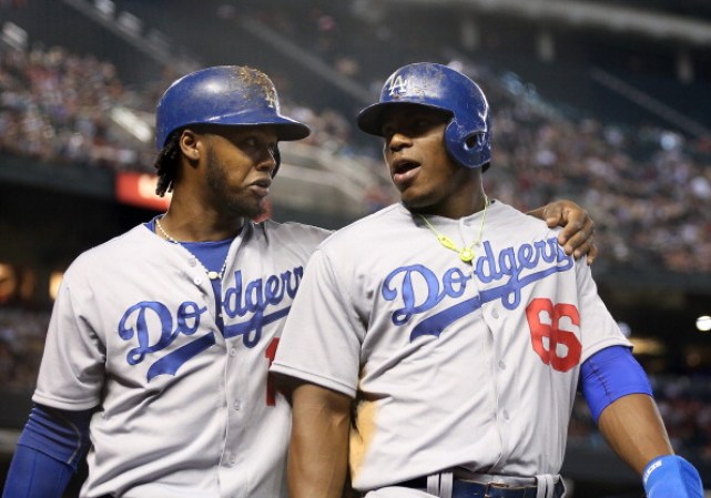 Yasiel Puig #66 de Los Angeles Dodgers junto a hanley Ramírez.