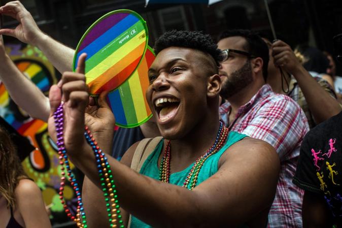 NEW YORK, NY - JUNE 30: Revelers watch the New York Gay Pride Parade on June 30, 2013 in New York City. This year's parade was a particularly festive occasion, due to the recent Supreme Court Ruling that it was unconstitutional to ban gay marriage. (Photo by Andrew Burton/Getty Images)