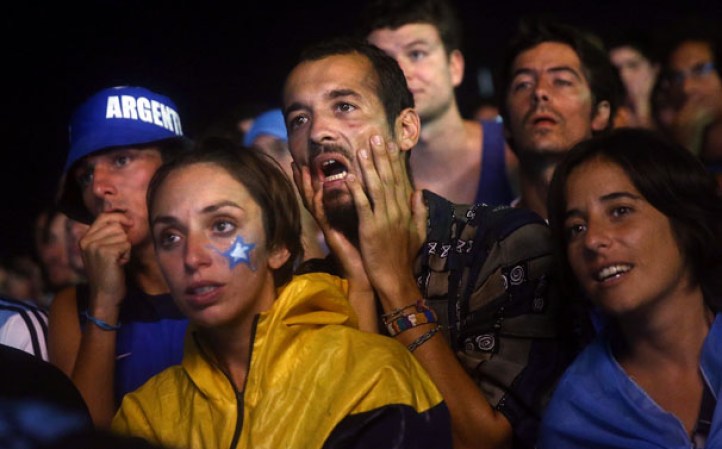 RIO DE JANEIRO, BRAZIL - JULY 09: Argentina fans watch on Copacabana Beach during their match against the Netherlands in the 2014 FIFA World Cup on July 9, 2014 in Rio de Janeiro, Brazil. Argentina went on to win in a shootout and advances to the final match at Maracana. (Photo by Mario Tama/Getty Images)