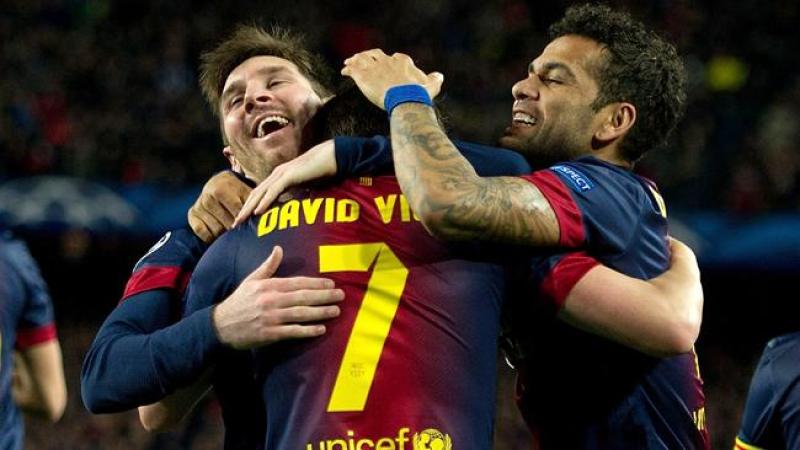 Leo Messi (izquierda), David Villa (centro) y Dani Alves (derecha), del equipo Barcelona.