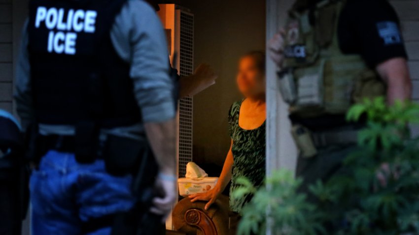 RIVERSIDE, CA – AUGUST 12: ICE Enforcement and Removal Operations officers, in search of 32-year-old Hugo Medina, question his mother Magdalena Medina, 69, about his whereabout in a morning raid on his residence in Riverside. Immigration and Customs Enforcement officials say they are relying more than ever on costly manhunts to locate immigrants in the country illegally who have criminal records. In the past, the agency would simply contact local jails where such immigrants were being detained and ask jail officials to hold them until an ICE van could pick them up, but hundreds of counties across the country stopped honoring such requests after a federal judge last year found that practice unconstitutional. (Irfan Khan/Los Angeles Times via Getty Images)