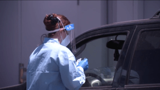 Nurse at drive-up Covid testing sight