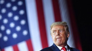 President Donald Trump gestures during a campaign rally at MBS International Airport in Freeland, Mich., Sept. 10, 2020.