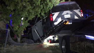 A Fort Worth police officer was hospitalized and a teenager placed into custody after a crash Wednesday night, officials say.