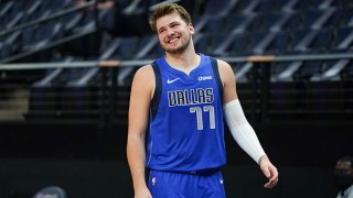 Luka Doncic #77 of the Dallas Mavericks smiles during the game against the Minnesota Timberwolves on May 16, 2021 at Target Center in Minneapolis, Minnesota.