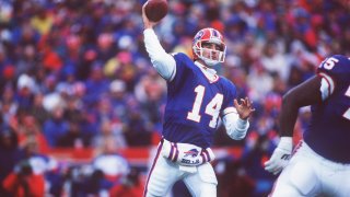 Buffalo Bills quarterback frank Reich sets and throws during the Bills 41-38 overtime win over the Houston Oilers in the AFC Playoff Game at Rich Stadium in Orchard Park, New York, on Jan. 3, 1993.