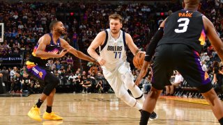 Luka Doncic #77 of the Dallas Mavericks drives to the basket against the Phoenix Suns during Game 5 of the 2022 NBA Playoffs Western Conference Semifinals on May 10, 2022 at Footprint Center in Phoenix, Arizona.