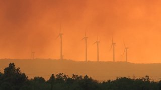 A wildfire that has burned dozens of homes was still only 5% contained Thursday afternoon after charring more than 15 square miles of juniper and mesquite brush 18 miles southwest of Abilene.