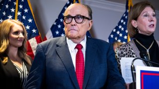 Rudolph Giuliani, attorney for President Donald Trump, conducts a news conference at the Republican National Committee on lawsuits regarding the outcome of the 2020 presidential election on Thursday, November 19, 2020. Trump attorneys Jenna Ellis, left,and Sydney Powell, also appear.