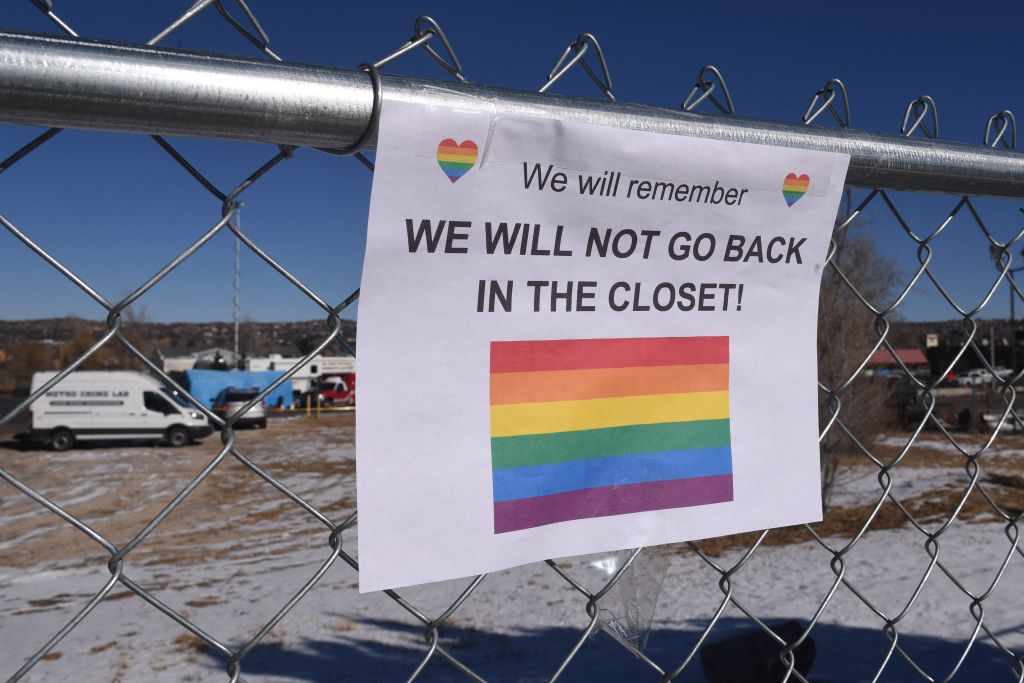 A sign hangs from a fence near Club Q, an LGBTQ nightclub, in Colorado Springs, Colorado, on November 20, 2022. &#8211; At least five people were killed and 18 wounded in a mass shooting at an LGBTQ nightclub in the US city of Colorado Springs, police said on November 20, 2022. (Photo by Jason Connolly / AFP) (Photo by JASON CONNOLLY/AFP via Getty Images)