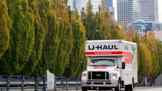 U-Haul truck driving on an empty road