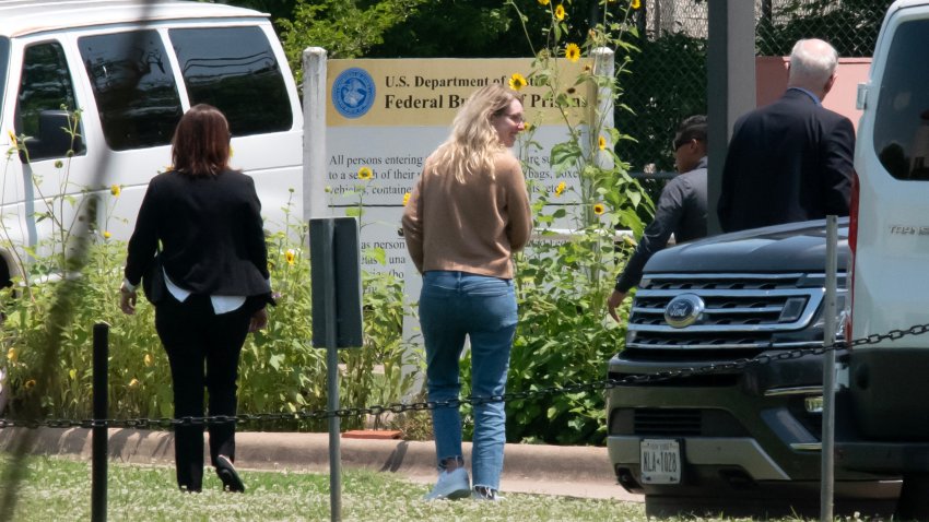 Elizabeth Holmes arrives at the Federal Prison Camp in Bryan, Texas.