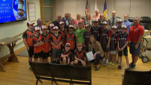 Dr. Jennifer LaFemina accepts a lifesaving merit award with the Oxford Town Council, the Algonquin 10U Baseball team and various community members on Tuesday, July 16 ,2024.