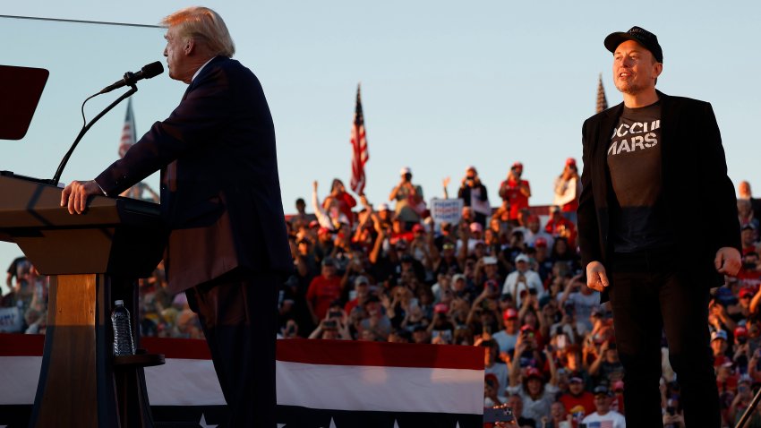 BUTLER, PENNSYLVANIA – OCTOBER 05: Elon Musk steps onto stage as Republican presidential nominee, former President Donald Trump addresses a campaign rally from behind bullet resistant glass at the Butler Farm Show fairgrounds on October 05, 2024 in Butler, Pennsylvania. This is the first time that Trump has returned to Butler since he was injured during an attempted assassination on July 13.  (Photo by Anna Moneymaker/Getty Images)