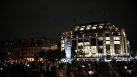 PARIS, FRANCE – NOVEMBER 15: Virgin and Child Statue is carried towards Cathedral Notre-Dame De Paris on November 15, 2024 in Paris, France. The  return of  the Virgin and Child starts with a torchlit procession in front of the church of Saint-Germain-l’Auxerrois and then leads to  square in front of the cathedral of Notre-Dame de Paris which is set to reopen on december 7th, 2024. On the evening of Monday, April 15, 2019, a fire broke out in Notre-Dame Cathedral and quickly spread to the wooden roof, causing extensive damage to the building and destroying its famous spire. (Photo by Aurelien Meunier/Getty Images)