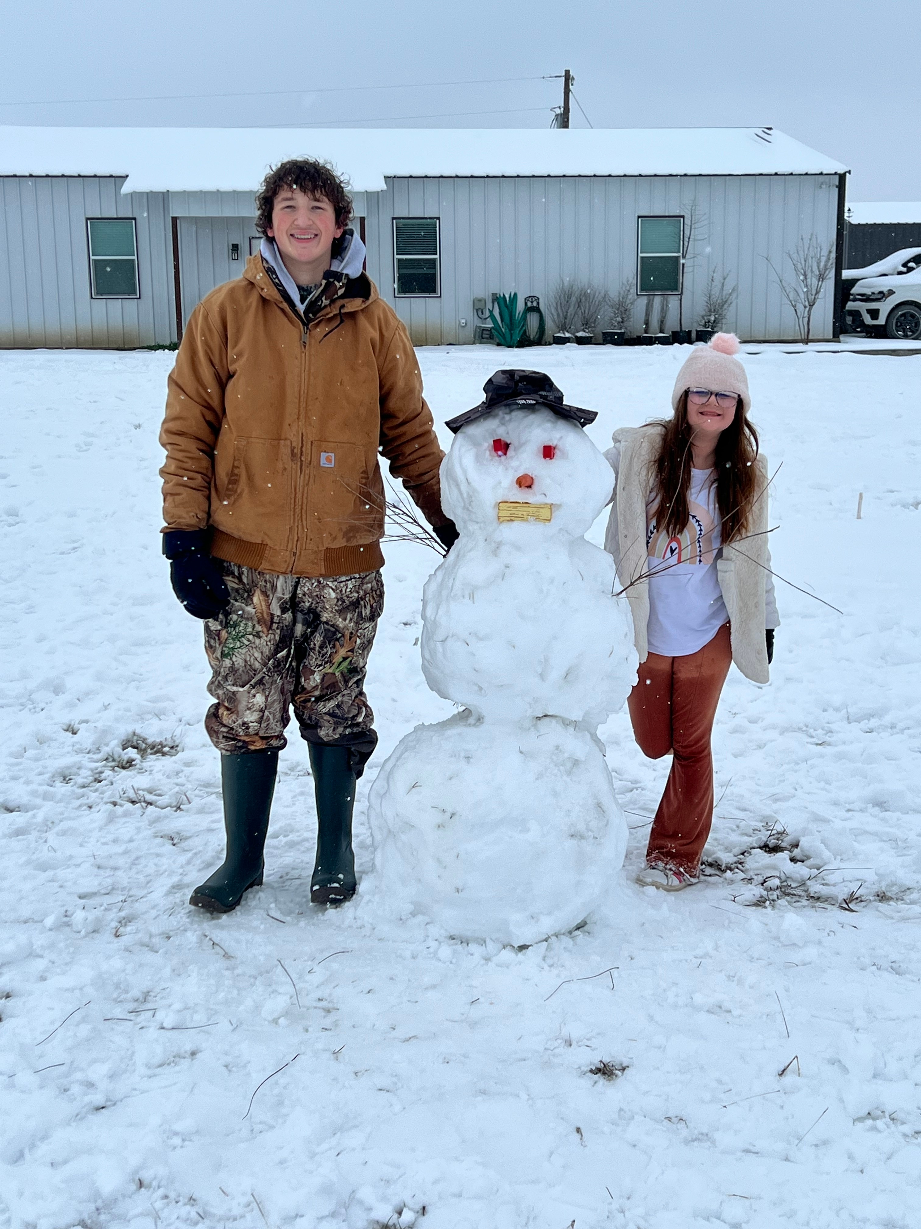 With the 6” of snow my kids Ben and Emma made a snowman.