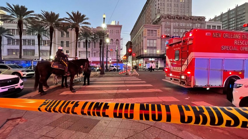 Police cordon off the intersection of Canal Street and Bourbon Street in the French Quarter of New Orleans, Louisiana, on January 1, 2025. At least 10 people were killed and 30 injured Wednesday when a vehicle plowed overnight into a New year’s crowd in the heart of the thriving New Orleans tourist district, authorities in the southern US city said. (Photo by Matthew HINTON / AFP) (Photo by MATTHEW HINTON/AFP via Getty Images)