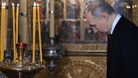 In this pool photograph distributed by Russian state agency Sputnik, Russian President Vladimir Putin prays in the Annunciation Cathedral following his inauguration ceremony at the Kremlin in Moscow on May 7, 2024. (Photo by Alexey MAISHEV / POOL / AFP) (Photo by ALEXEY MAISHEV/POOL/AFP via Getty Images)