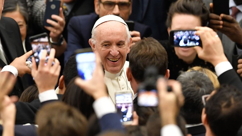 Pope Francis smiles as he arrives for his weekly general audience at the Paul VI audience hall on December 13, 2017 at the Vatican.  / AFP PHOTO / Andreas SOLARO        (Photo credit should read ANDREAS SOLARO/AFP via Getty Images)