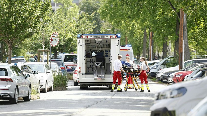 Rescue paramedics are seen next to an ambulance car close to a school where, according to reports, several people died in a shooting, on June 10, 2025 in Graz, southeastern Austria. Several people died in a school shooting, including the attacker, Austrian broadcaster ORF quoted the interior ministry as saying. (Photo by ERWIN SCHERIAU / APA / AFP) / Austria OUT (Photo by ERWIN SCHERIAU/APA/AFP via Getty Images)