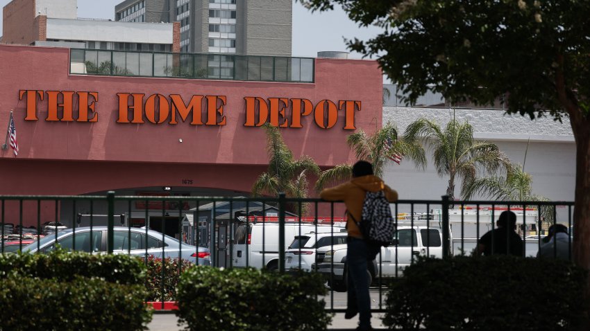 People wait outside of a Home Depot store on Wilshire Blvd that was previously the site of Immigration and Customs Enforcement (ICE) detention of day laborers in the Westlake MacArthur Park neighborhood of Los Angeles, California, on June 11, 2025. Protests against Donald Trump’s harsh immigration policies spread on June 11 across the United States despite a military-backed crackdown in Los Angeles and a threat by the Republican president to use “heavy force.” In Los Angeles, where the unrest began, an overnight curfew in the downtown area saw police make 25 arrests by morning. (Photo by Patrick T. Fallon / AFP) (Photo by PATRICK T. FALLON/AFP via Getty Images)