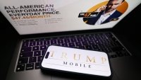 Trump Mobile website displayed on a laptop screen and Trump Mobile logo displayed on a phone screen are seen in this illustration photo taken in Krakow, Poland on June 16, 2025. (Photo by Jakub Porzycki/NurPhoto via Getty Images)