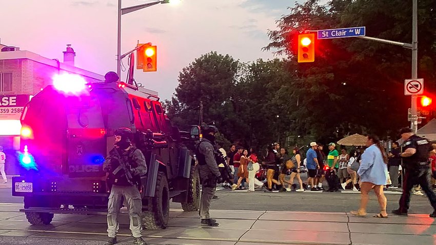Emergency Task Force vehicles and police officers are seen on the site of a shooting in Toronto, Canada on July 11, 2026. Police in Toronto were searching Saturday night, July 11, for an active shooter who had killed two people and wounded five in an area lined with shops and restaurants.
"Please avoid the area immediately and follow all directions from police," Toronto police said in a X post. (Photo by Jorge UZON / AFP via Getty Images)