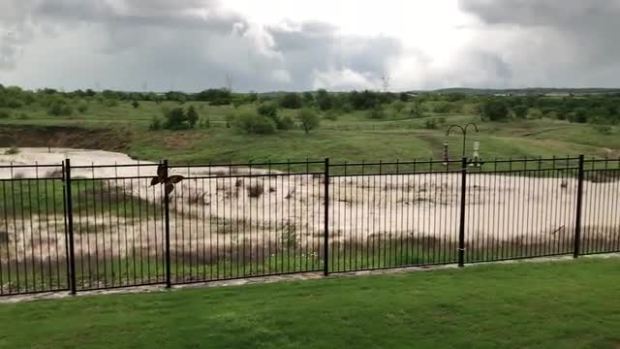 Flooding in South Denton county this ditch behind our house normally has no water in it